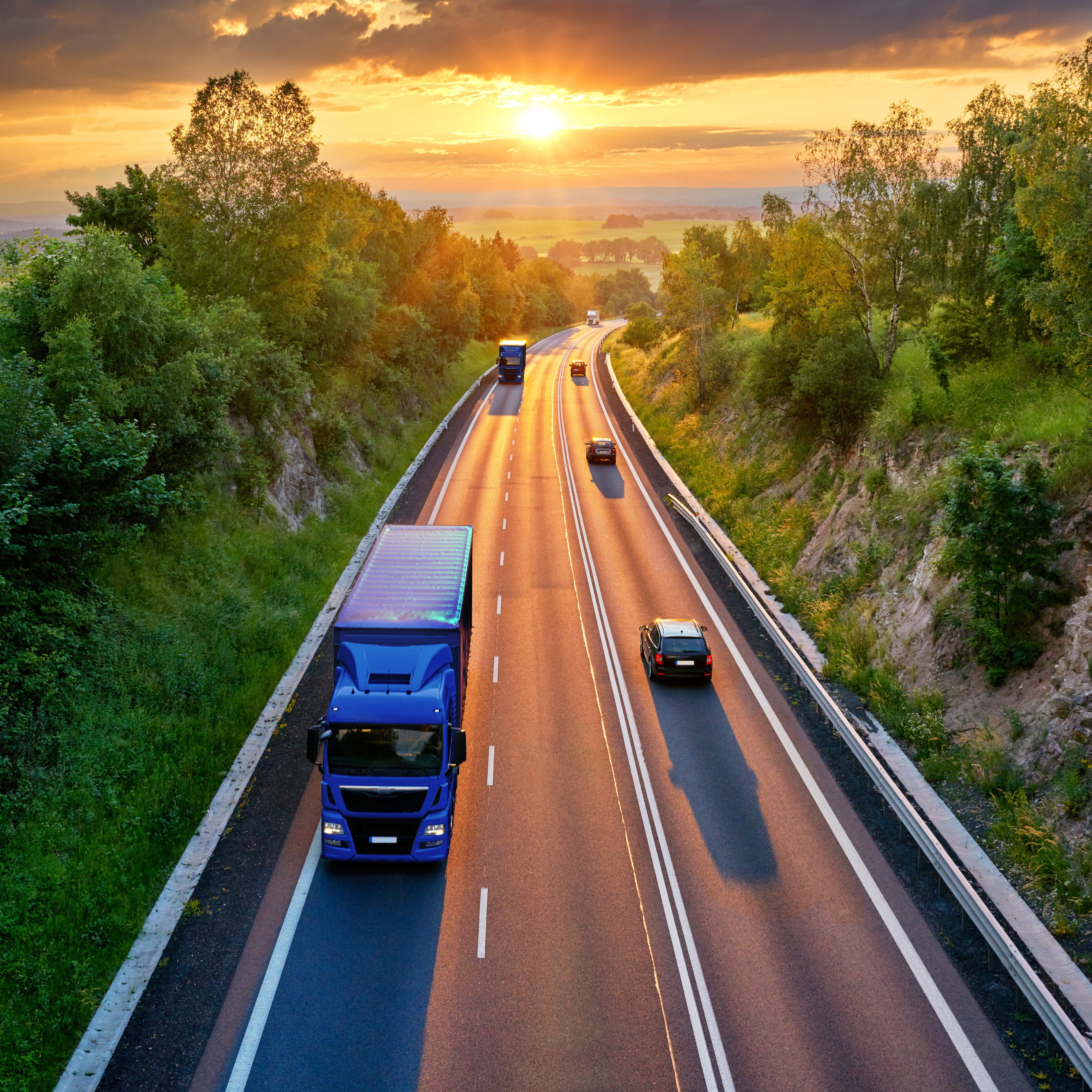 Road with a truck during sunset